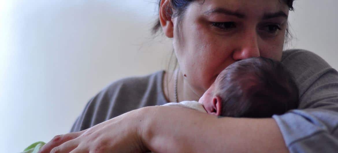 A mother holds her newborn baby at a hospital in Kyiv, Ukraine.